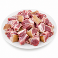Skin-on goat curry pieces – illustrative image